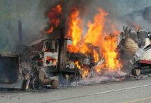 Inferno Engulfs Warehouse, Godfather Church Unscathed Burning semi-truck cab and trailer on highway