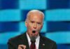 New Docs Reveal Biden’s DYSTOPIAN Censorship Plans man in suit speaking passionately at a podium