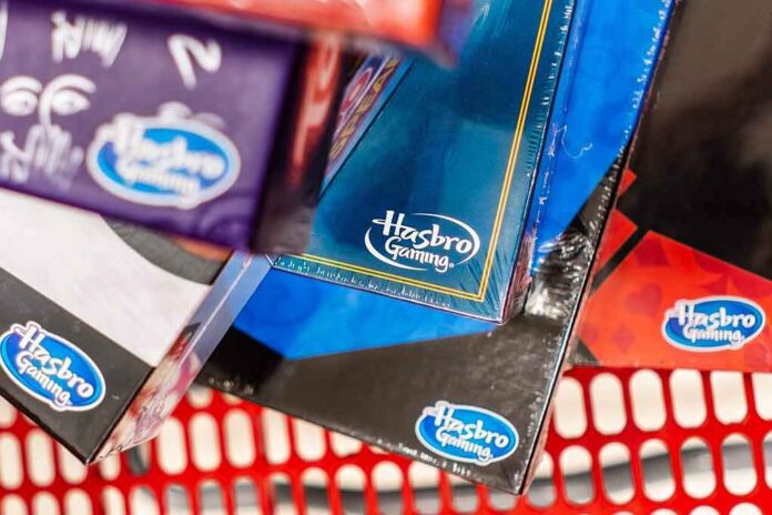 Hasbro Gaming board game boxes in a shopping cart