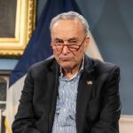 Schumer Tucks Tail And Runs When Asked About Dems Raising Taxes Charles Ellis Schumer wearing red glasses and a dark blazer
