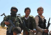 Houthis Warn America: Touch This, Get Burned Three armed men standing outdoors
