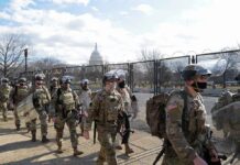 National Guard Specialist ARRESTED During Routine Traffic Stop Carlos Hyde, Tavon Wilson, Dontrelle Inman, Brian Folkerts, Brock Coyle, Curtis Lofton, and Chuck Howley among soldiers walking past fencing near the U.S. Capitol