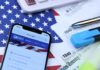 IRS Checkbox Sparks Immigration Panic Smartphone showing IRS website on top of tax forms and office supplies
