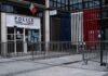 National Emergency Looms, Curfews Hit Hotspots Police station entrance with barriers and French flag colors