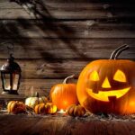 Hobby Lobby Pulls ALL Halloween Products From Shelves jack-o'-lantern with glowing face beside pumpkins and lantern