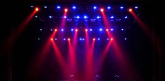 stage with red and blue spotlights shining onto an empty floor
