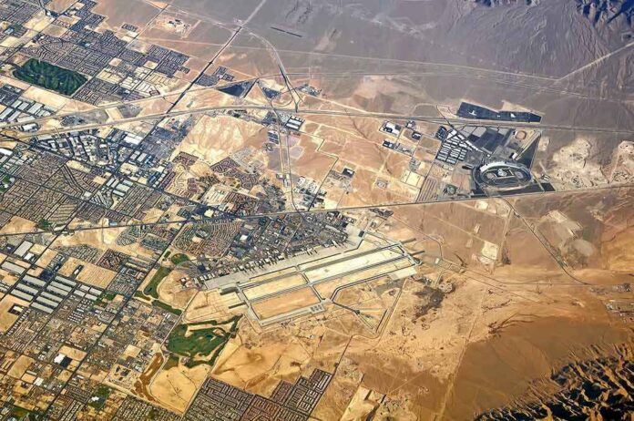 Aerial view of desert city with airport and highways