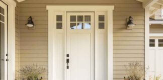 white front door with sidelights and planters