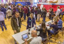 Breaking: Early Voting Reveals Democrats Faltering! Don MacLean in a busy gymnasium voting station with check-in tables