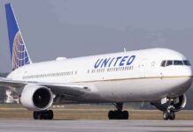 United Airlines jet taxiing on runway