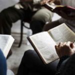 Christians NUKE Talarico’s Bible Abortion Claim Hands holding open books in a small discussion circle